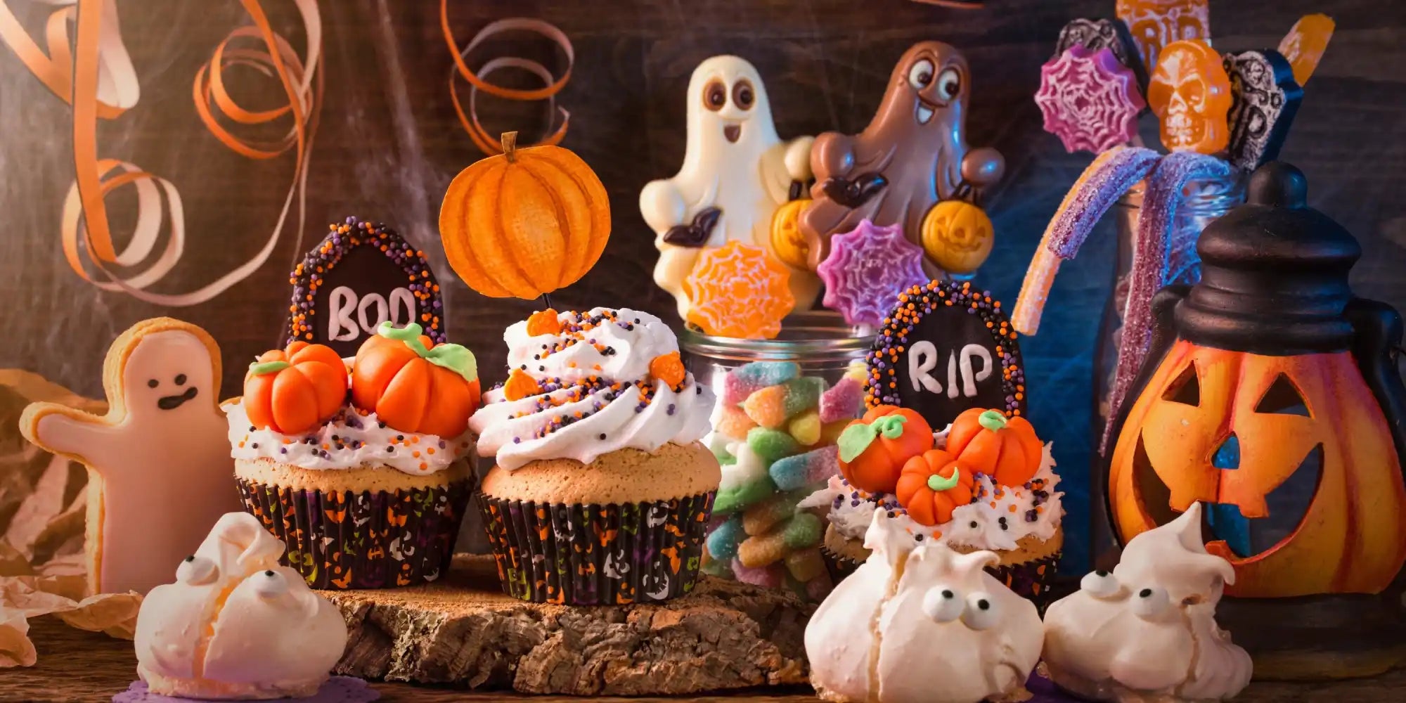 An assortment of Halloween-themed sweets and desserts.