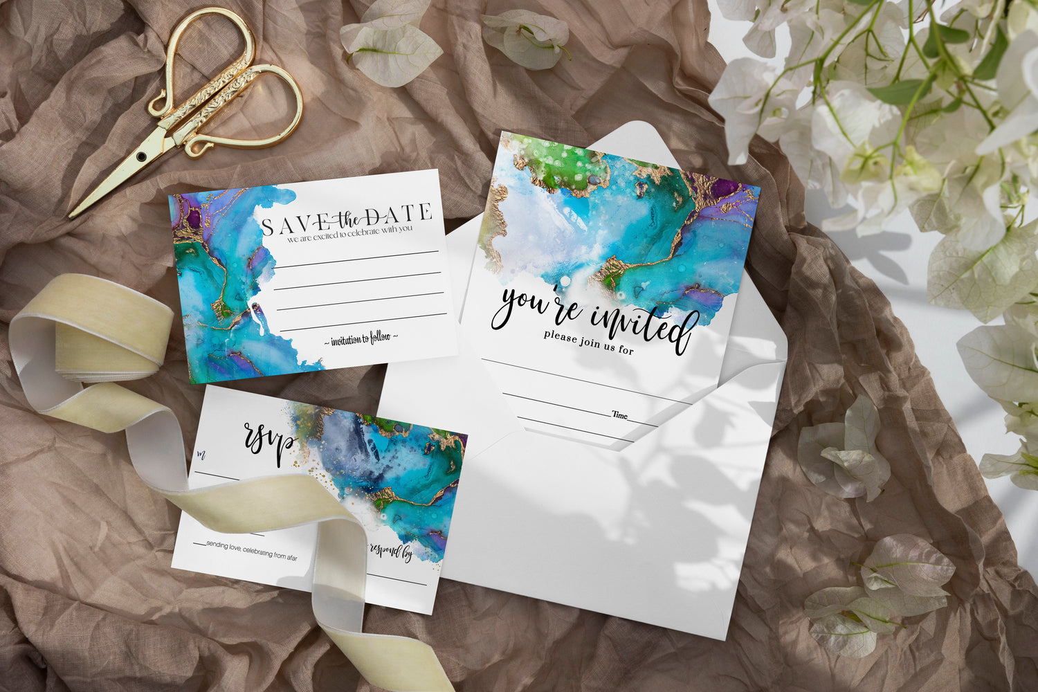 Step into a world of elegance with our watercolor jeweled wedding collection, where teal and purple meet touches of gold