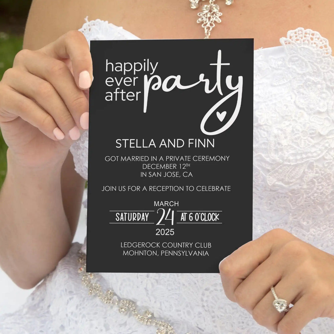 A black wedding reception invitation card held by a person.