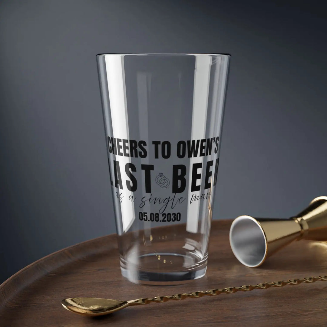 Personalized groom gift pint glass featuring ’last beer as a single man’ in black calligraphy with name and wedding